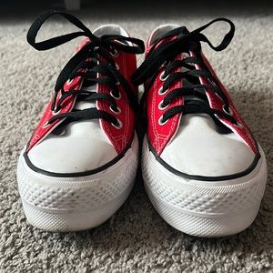 Red and white converse sneakers